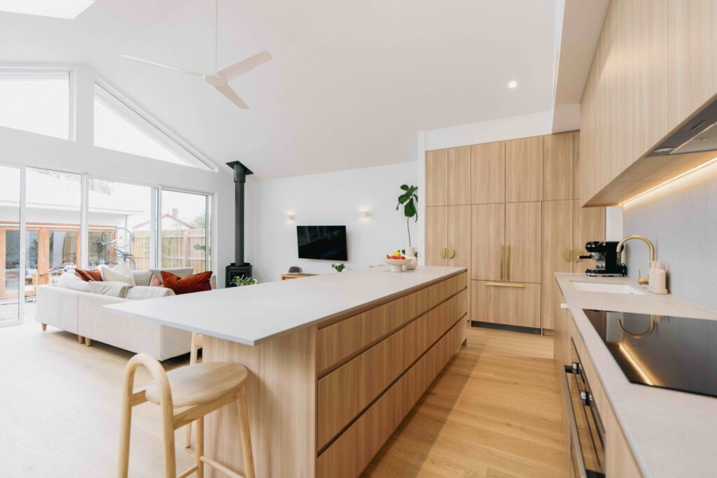 Renovated open plan lounge room and kitchen in Nothcote home with Valencia European Oak engineered timber flooring.
